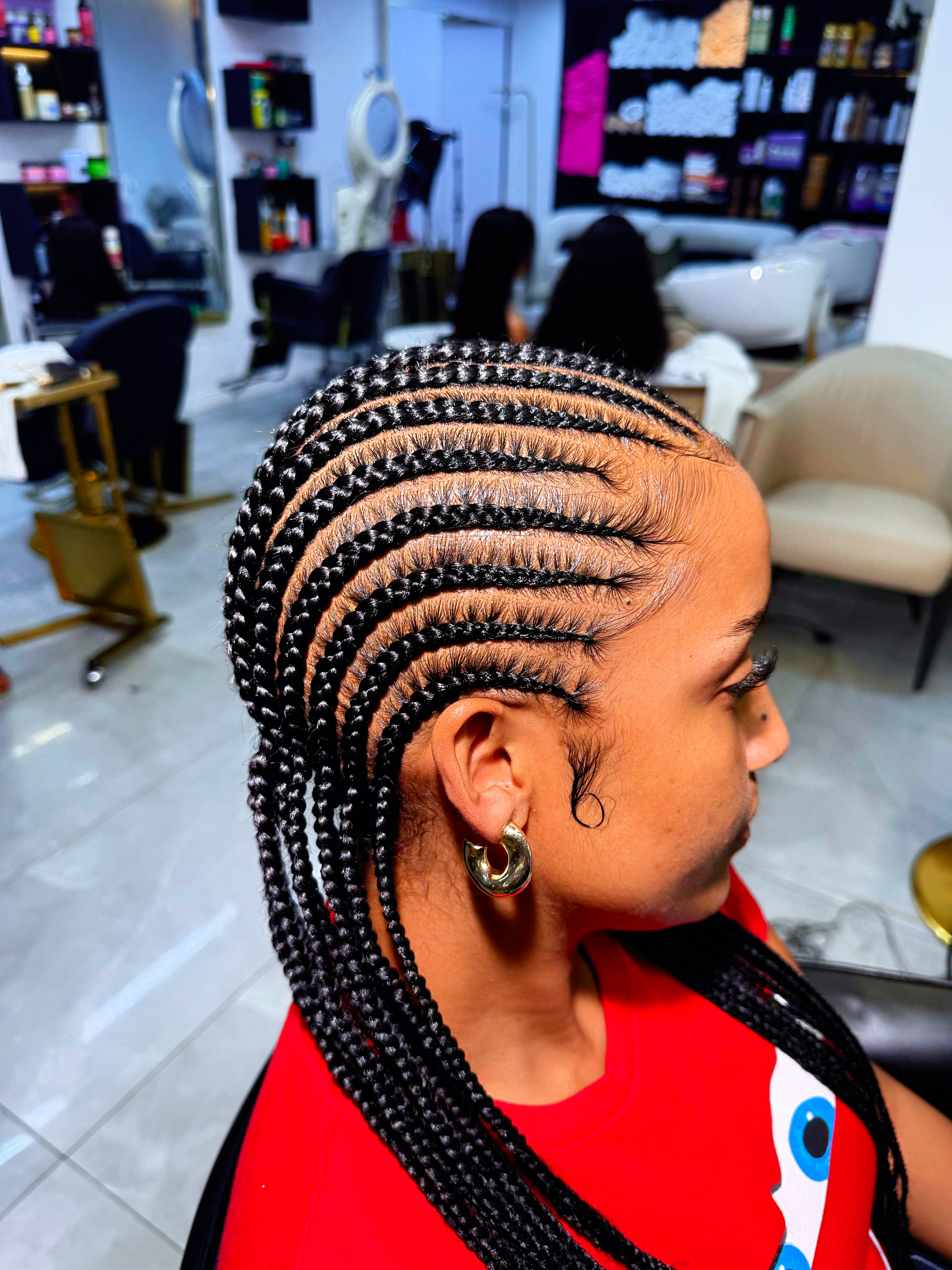 Feed-In Cornrows in Salon — Cornrows & feed-in braids at Qasr Alshar Salon, Dubai — crisp, precise lines near Union Metro, Deira.