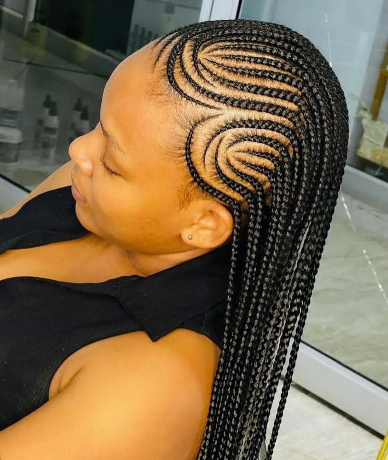 Swirl Cornrows Side View — Cornrows & feed-in braids at Qasr Alshar Salon, Dubai — crisp, precise lines near Union Metro, Deira.